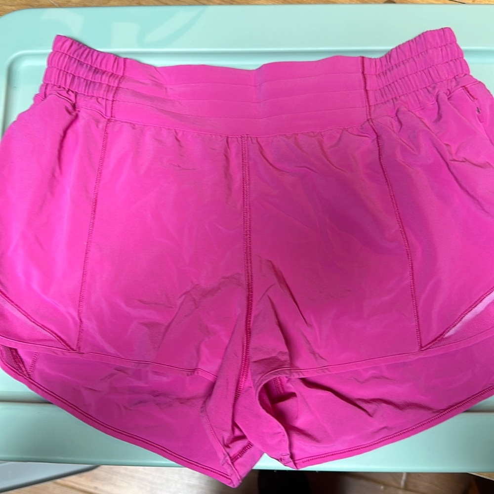 Neon pink Lululemon hotty hot low rise 2.5 run shorts, never worn! Size 12